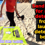 Sand scoop for metal detecting from a laundry detergent bottle